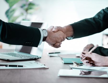 Shaking hands in an office environment