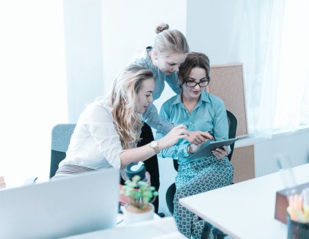 Three women work together