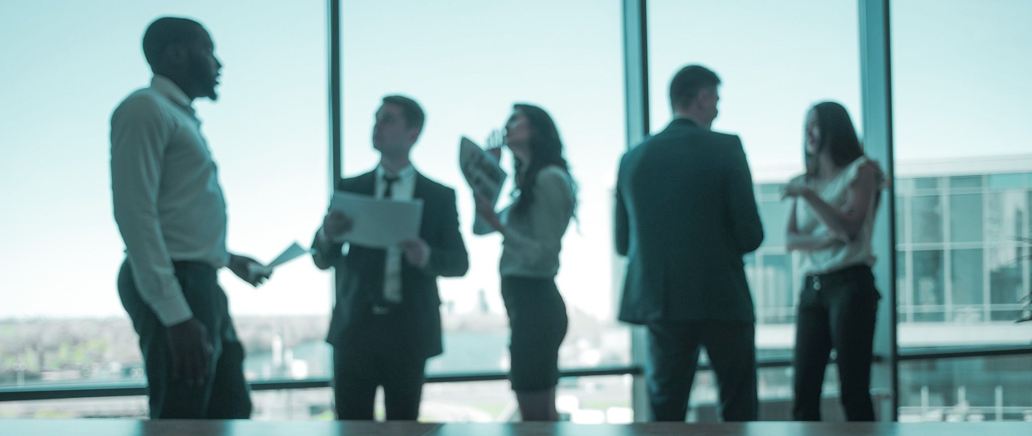 Group of people in front of a window